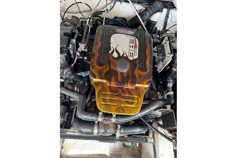 Slide: The Image of Engine of a 1998 Formula 330 Sun Sport with flame design cover. - 15