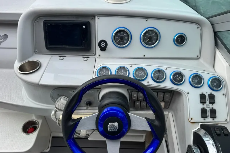 Slide: The Image of 1998 Formula 330 Sun Sport dashboard with steering wheel and gauges. - 3