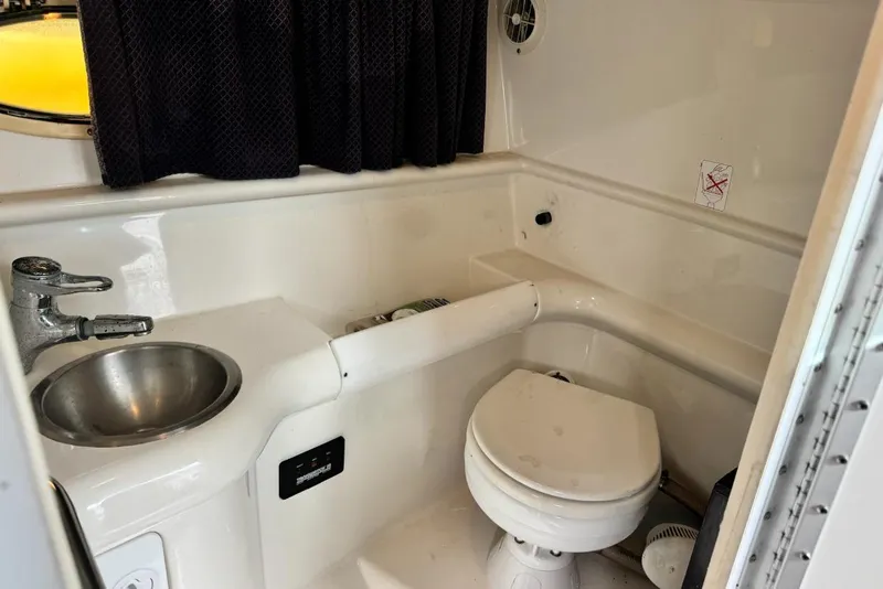 Slide: The Image of 1998 Formula 330 Sun Sport boat bathroom with sink and toilet. - 6