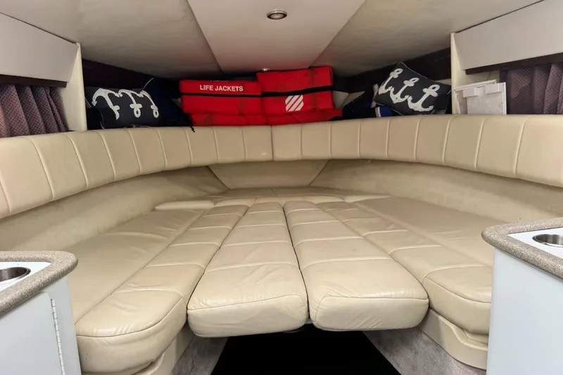 Slide: The Image of Interior of 1998 Formula 330 Sun Sport boat with beige seating and life jackets. - 7