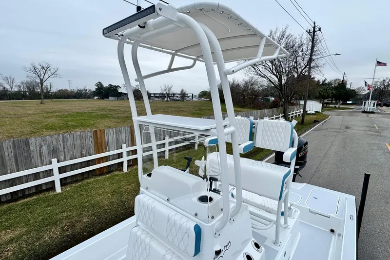 Slide: The Image of 2026 Shallow Sport 24 Modified V boat with elevated seating and sleek design. - 15