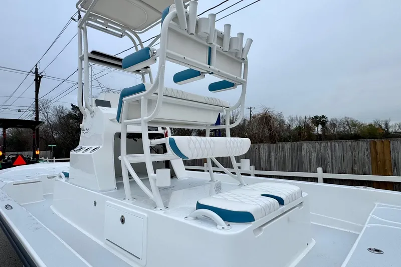 Slide: The Image of 2026 Shallow Sport 24 Modified V boat with elevated seating and rod holders. - 8