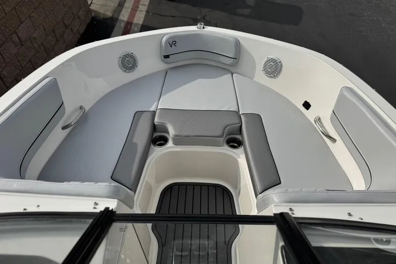 Slide: The Image of 2022 Bayliner VR5 Bowrider I/O boat interior with gray seating and cup holders. - 13