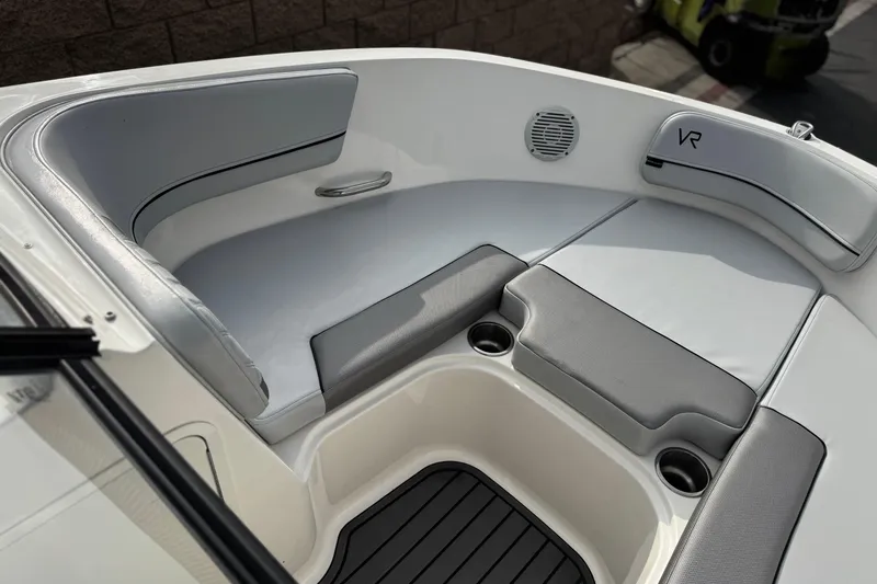 Slide: The Image of 2022 Bayliner VR5 Bowrider I/O boat interior with cushioned seating and cup holders. - 14
