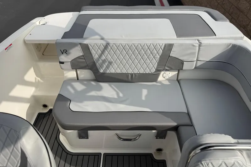 Slide: The Image of 2022 Bayliner VR5 Bowrider I/O interior seating with gray and white upholstery. - 17