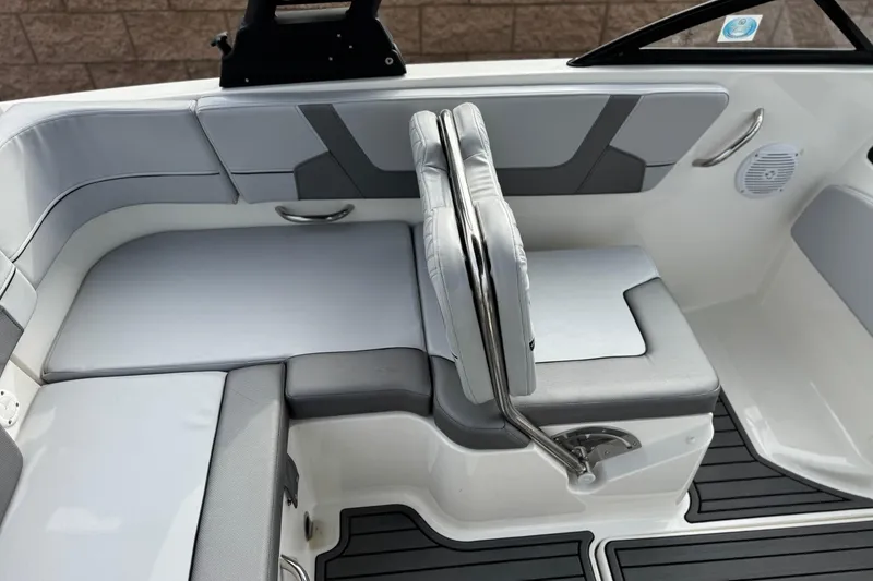 Slide: The Image of 2022 Bayliner VR5 Bowrider I/O interior seating with gray and white upholstery. - 20