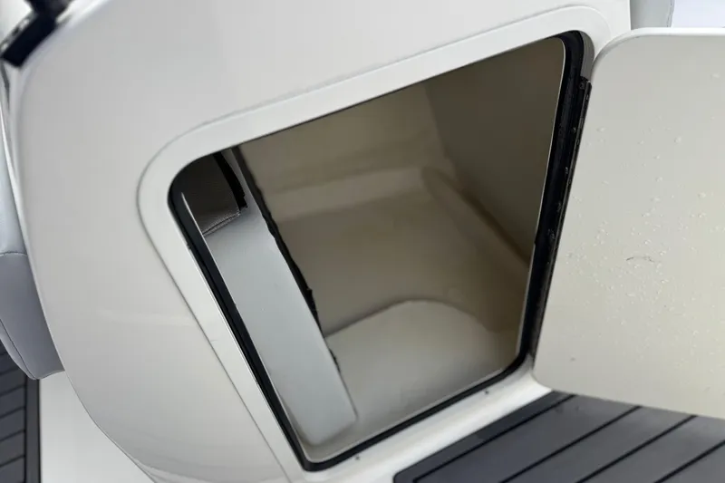 Slide: The Image of 2022 Bayliner VR5 Bowrider I/O storage compartment with open door. - 26