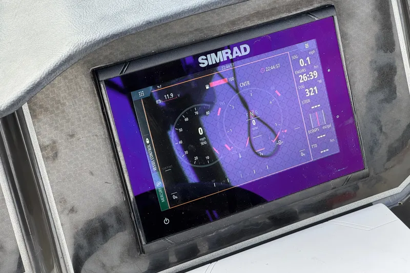 Slide: The Image of Simrad display on 2022 Bayliner VR5 Bowrider I/O showing navigation and engine data. - 31