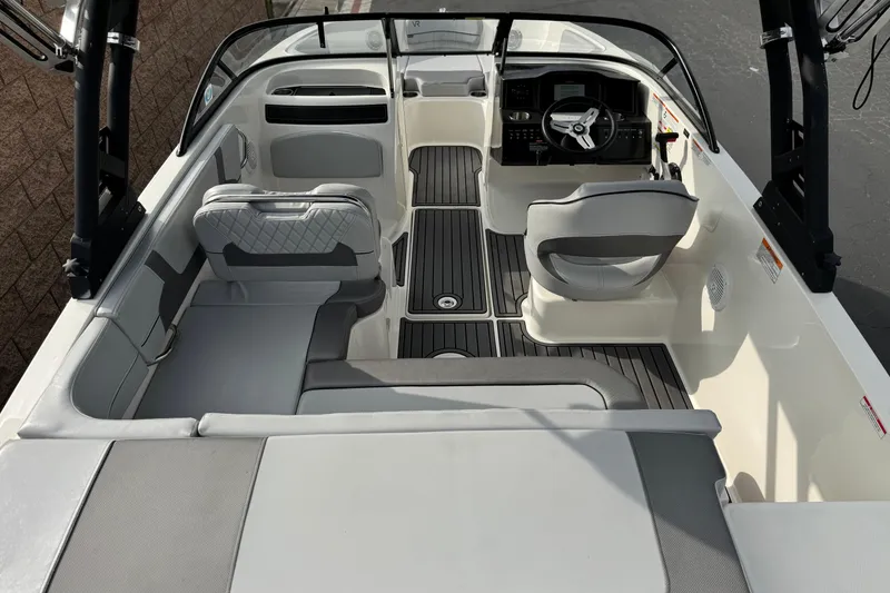 Slide: The Image of 2022 Bayliner VR5 Bowrider I/O interior with sleek seating and modern dashboard design. - 9
