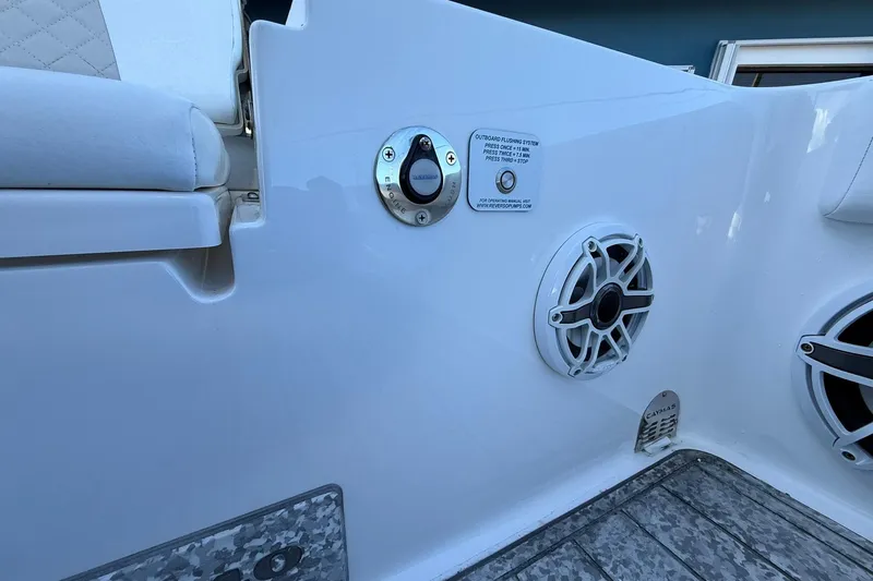 Slide: The Image of 2022 Caymas 28 HB Twin boat interior with speaker and control panel. - 12