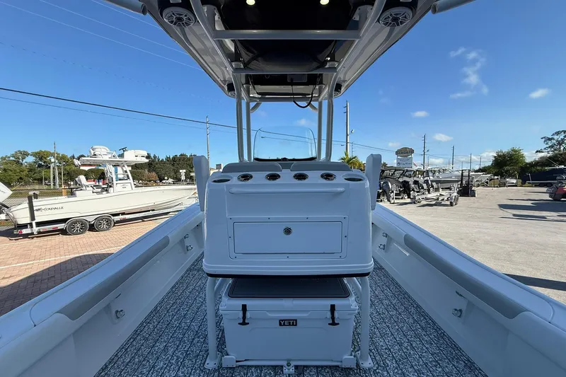 Slide: The Image of 2022 Caymas 28 HB Twin boat interior with console and Yeti cooler. - 14