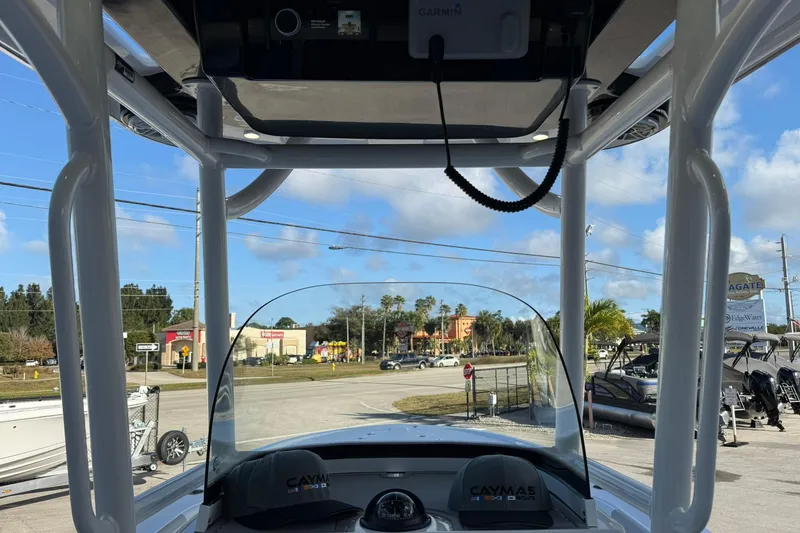 Slide: The Image of 2022 Caymas 28 HB Twin boat interior with clear windshield and overhead electronics. - 22