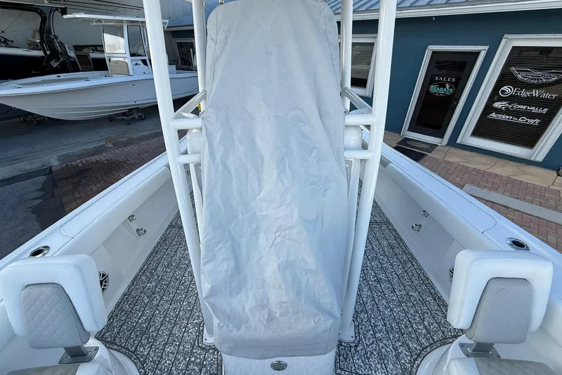 Slide: The Image of 2022 Caymas 28 HB Twin boat interior with covered console and seating. - 33