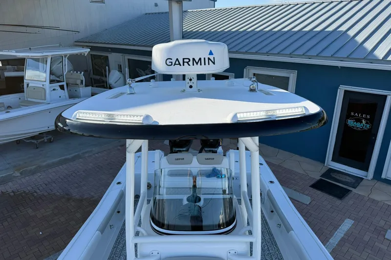 Slide: The Image of 2022 Caymas 28 HB Twin boat with Garmin radar, docked near sales office. - 34