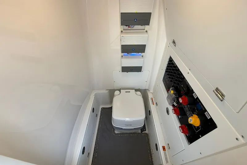 Slide: The Image of 2022 Caymas 28 HB Twin boat interior with toilet and control panel. - 35