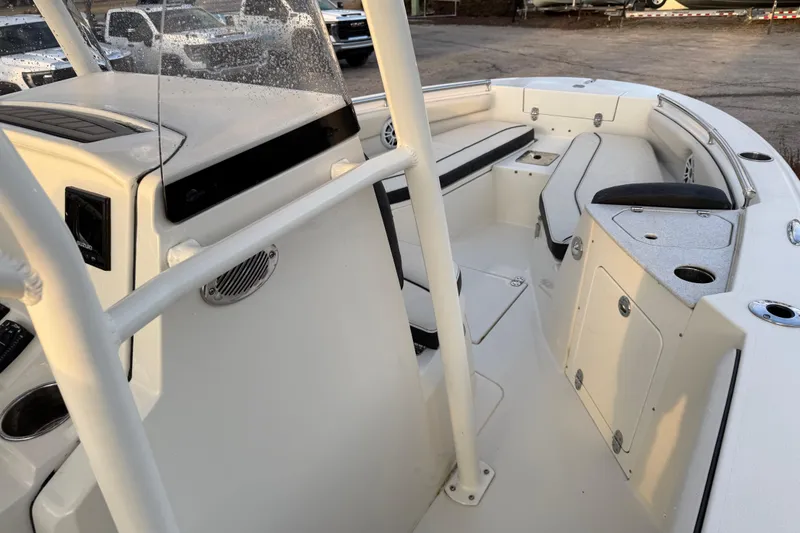 Slide: The Image of 2022 Stingray 216 CC boat interior with seating and storage compartments. - 36