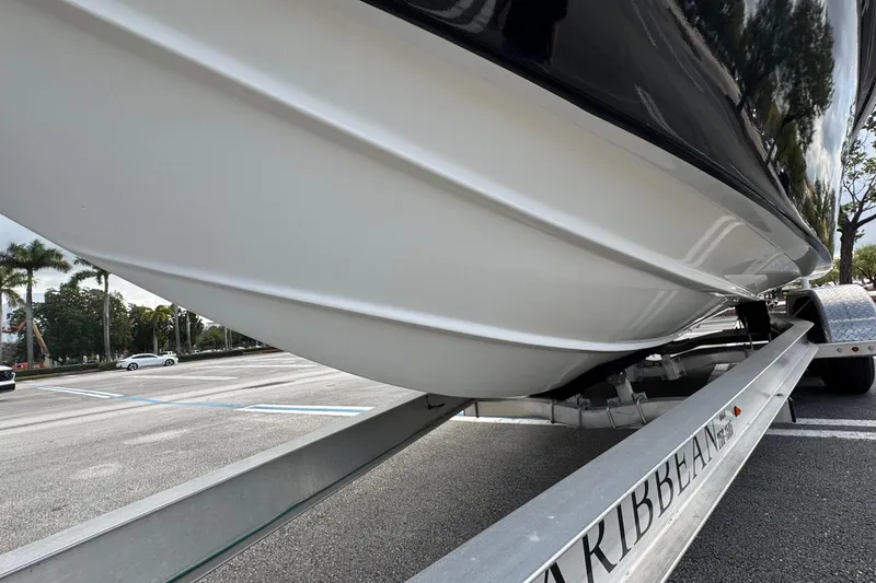 Slide: The Image of 2010 Paramount Sportfisherman 21' boat on trailer, parked in a lot. - 10