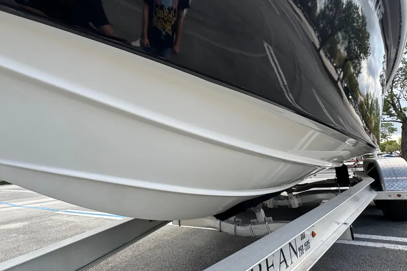 Slide: The Image of 2010 Paramount Sportfisherman 21' boat on trailer, side view. - 12