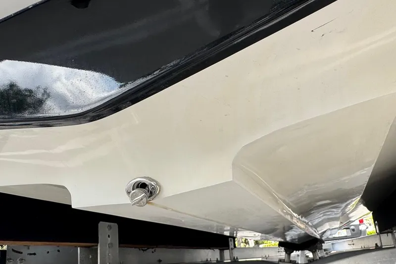 Slide: The Image of 2010 Paramount Sportfisherman 21' boat hull on trailer, showcasing sleek design and craftsmanship. - 13