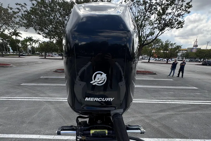 Slide: The Image of Mercury outboard motor on 2010 Paramount Sportfisherman 21' in parking lot. - 19