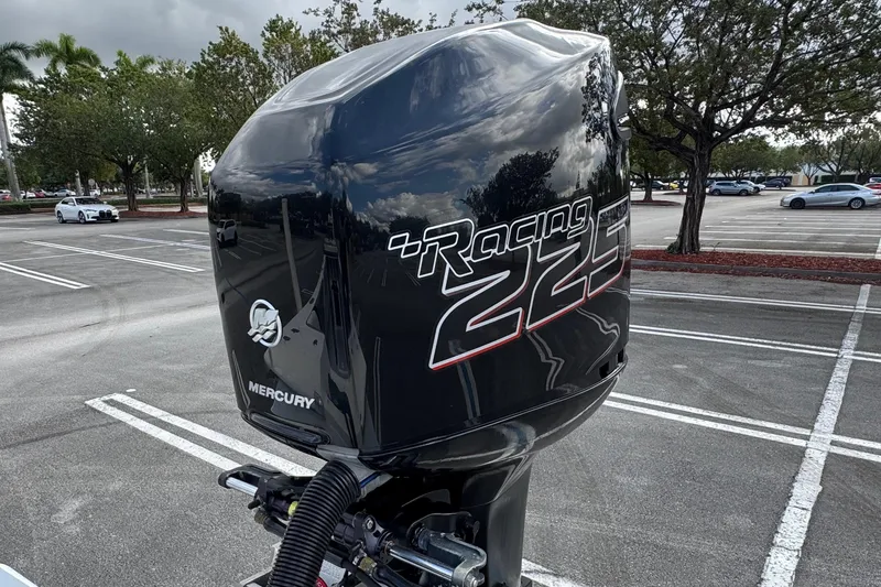 Slide: The Image of Mercury Racing 225 outboard motor on 2010 Paramount Sportfisherman 21' in parking lot. - 20