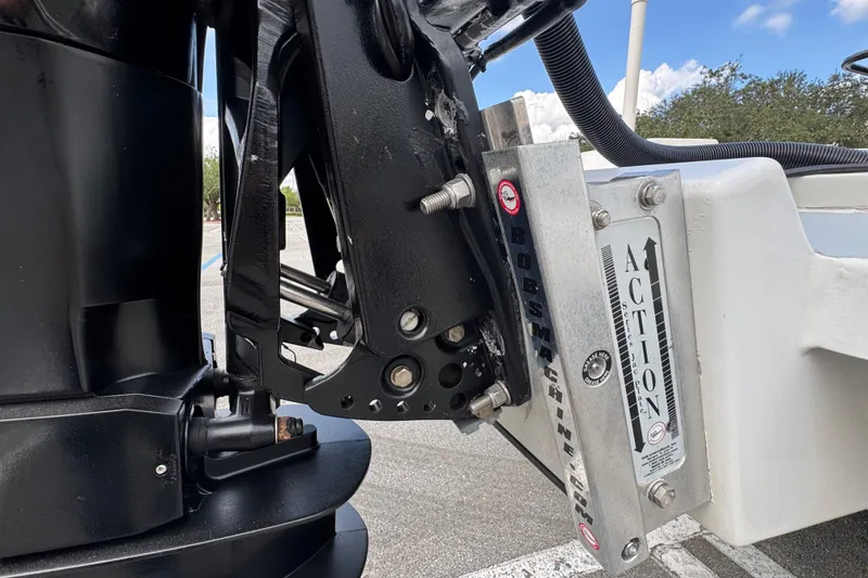 Slide: The Image of Close-up of a 2010 Paramount Sportfisherman 21' boat engine mount and jack plate. - 23