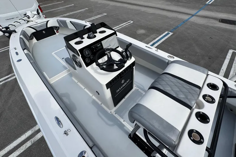 Slide: The Image of 2010 Paramount Sportfisherman 21' boat interior with steering console and seating. - 26