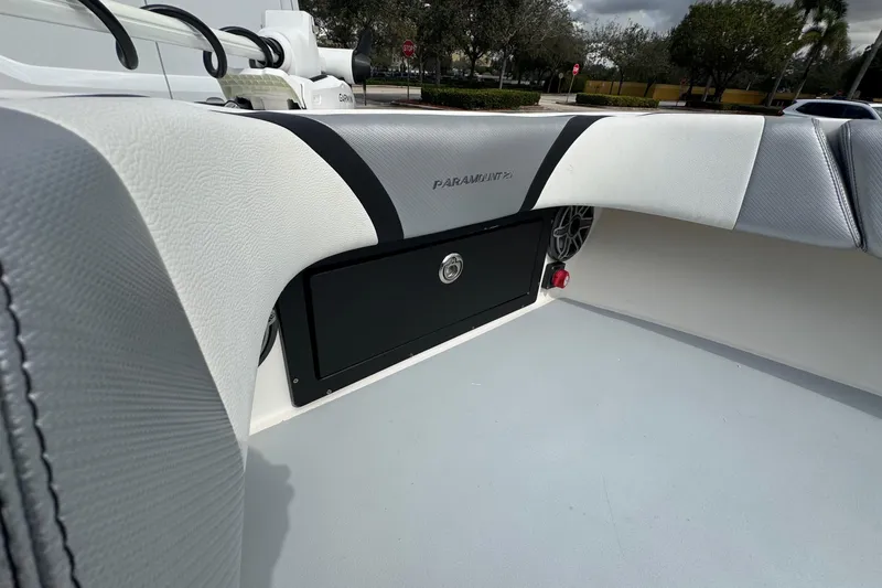 Slide: The Image of Interior of a 2010 Paramount Sportfisherman 21' boat, featuring sleek seating and storage. - 28