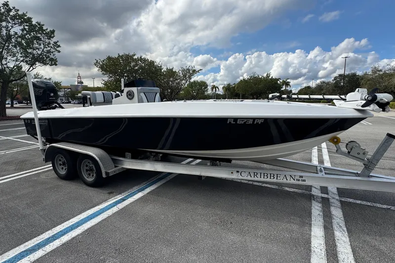 Slide: The Image of 2010 Paramount Sportfisherman 21' boat on trailer in parking lot. - 3