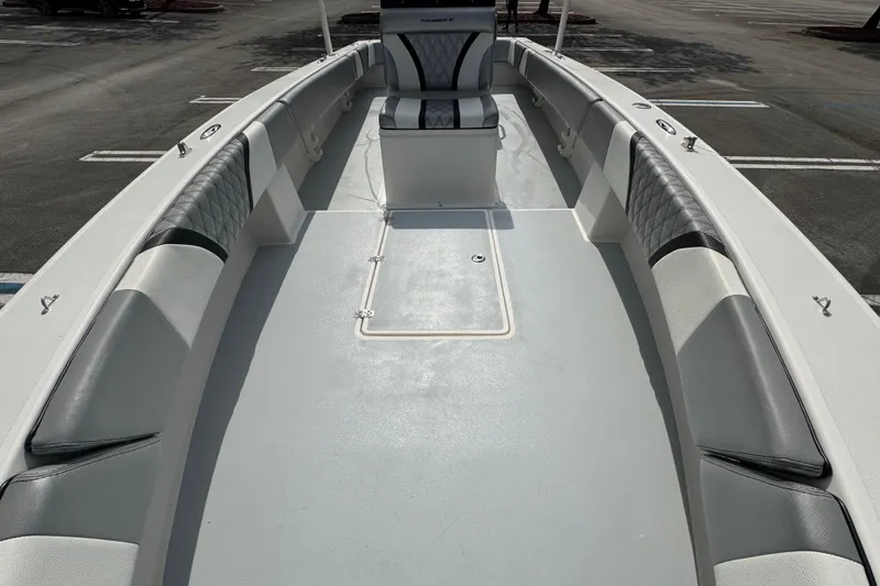 Slide: The Image of 2010 Paramount Sportfisherman 21' boat interior with cushioned seating and spacious deck. - 30