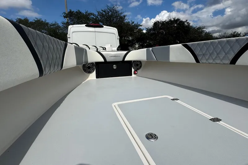 Slide: The Image of 2010 Paramount Sportfisherman 21' boat interior with cushioned seating and storage compartments. - 33