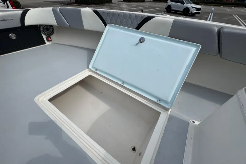 Slide: The Image of Open storage compartment on a 2010 Paramount Sportfisherman 21' boat deck. - 34