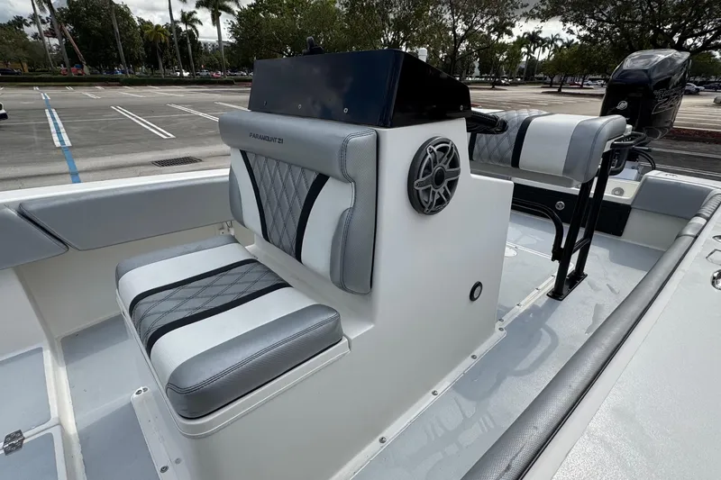 Slide: The Image of 2010 Paramount Sportfisherman 21' boat interior with cushioned seating and steering console. - 36