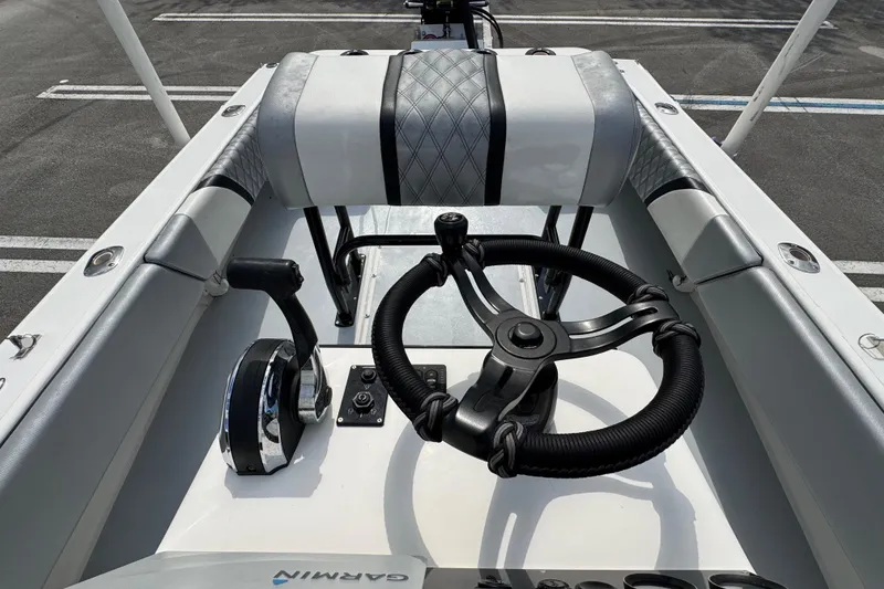 Slide: The Image of Steering console of a 2010 Paramount Sportfisherman 21' boat with Garmin equipment. - 38