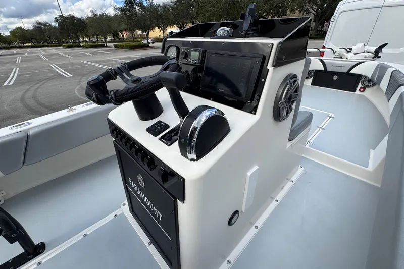 Slide: The Image of Control console of a 2010 Paramount Sportfisherman 21' boat, featuring modern navigation equipment. - 40
