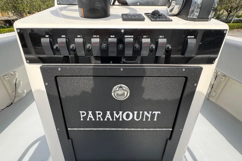 Slide: The Image of Control panel of a 2010 Paramount Sportfisherman 21' boat with labeled switches. - 42