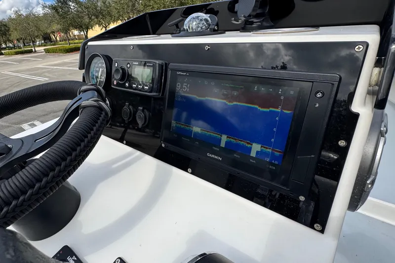 Slide: The Image of Dashboard of a 2010 Paramount Sportfisherman 21' with Garmin navigation display. - 44