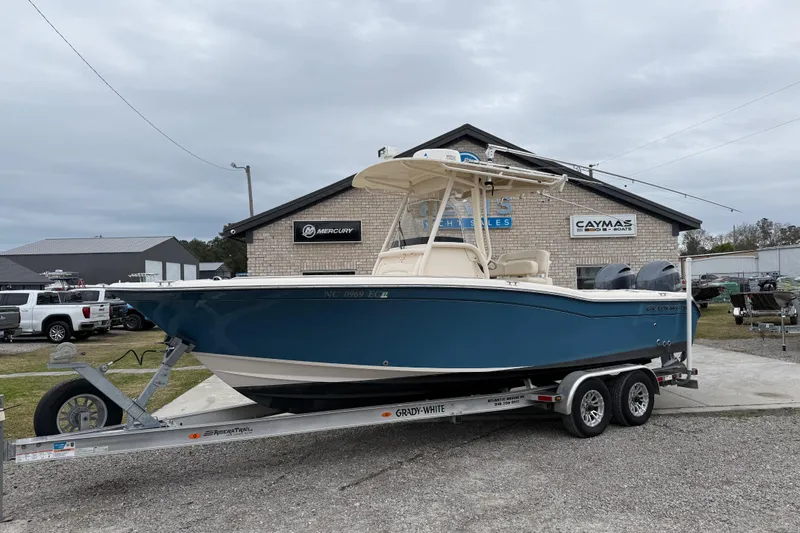 Slide: The Image of 2015 Grady-White Fisherman 257 boat on trailer, parked outside dealership. - 1