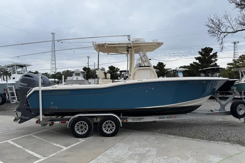 Slide: The Image of 2015 Grady-White Fisherman 257 boat on trailer, parked outdoors. - 10