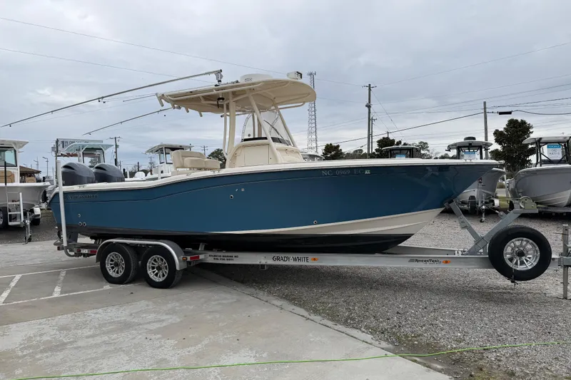 Slide: The Image of 2015 Grady-White Fisherman 257 boat on trailer, parked outdoors. - 11