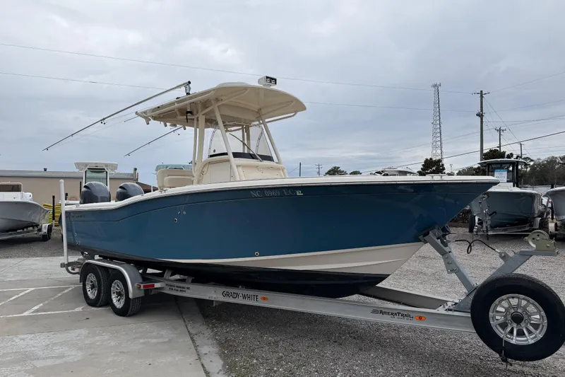 Slide: The Image of 2015 Grady-White Fisherman 257 boat on trailer, parked outdoors. - 12
