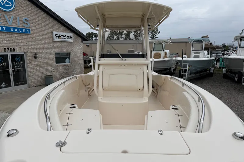 Slide: The Image of 2015 Grady-White Fisherman 257 boat at dealership, showcasing spacious interior and helm. - 14