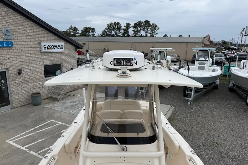 Slide: The Image of 2015 Grady-White Fisherman 257 boat displayed at dealership, surrounded by other boats. - 15