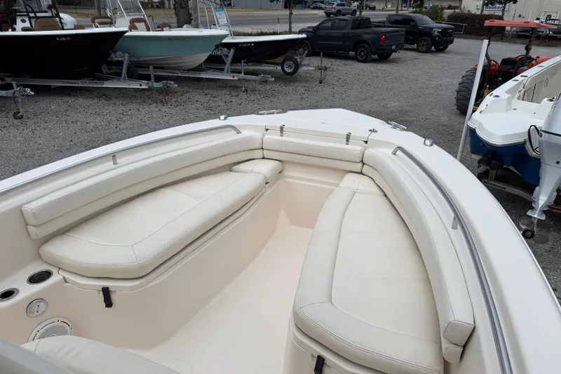 Slide: The Image of 2015 Grady-White Fisherman 257 boat interior with cushioned seating and cup holders. - 17