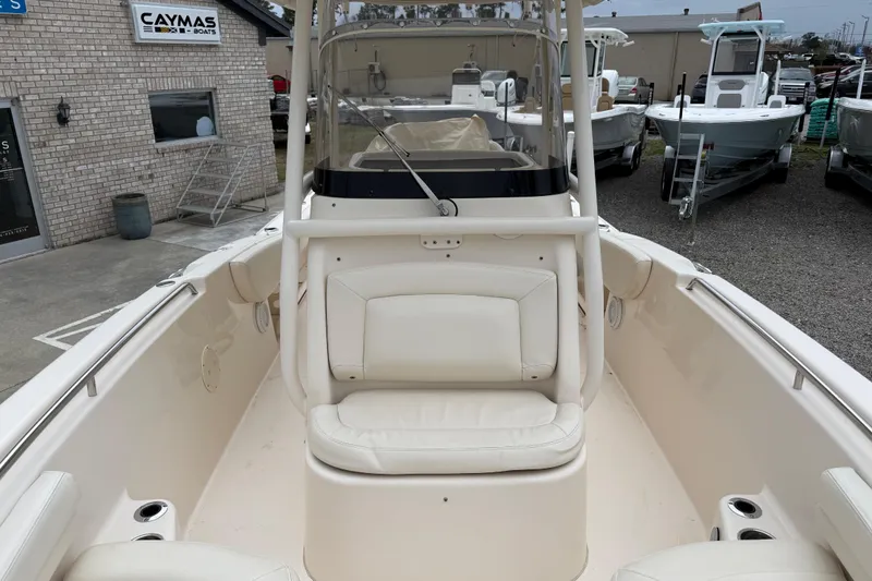 Slide: The Image of 2015 Grady-White Fisherman 257 boat interior with seating, displayed at a dealership. - 18
