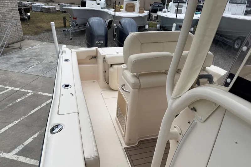 Slide: The Image of 2015 Grady-White Fisherman 257 boat interior with seating and dual engines. - 20