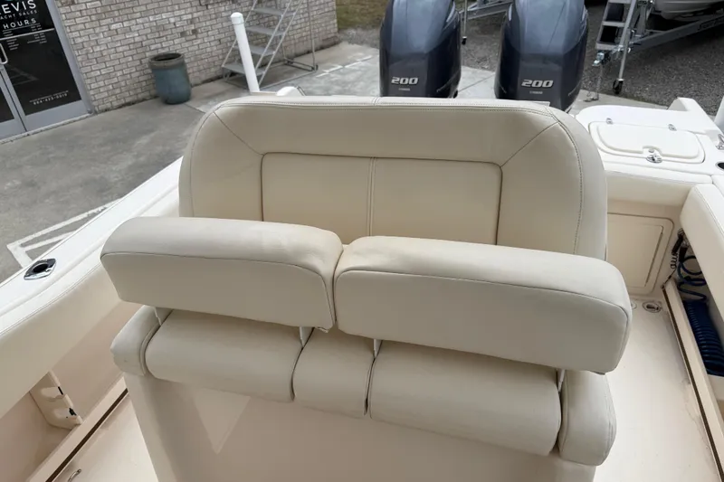 Slide: The Image of 2015 Grady-White Fisherman 257 boat seat with dual Yamaha 200 engines in background. - 22
