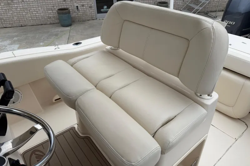 Slide: The Image of 2015 Grady-White Fisherman 257 boat with beige cushioned seating. - 25