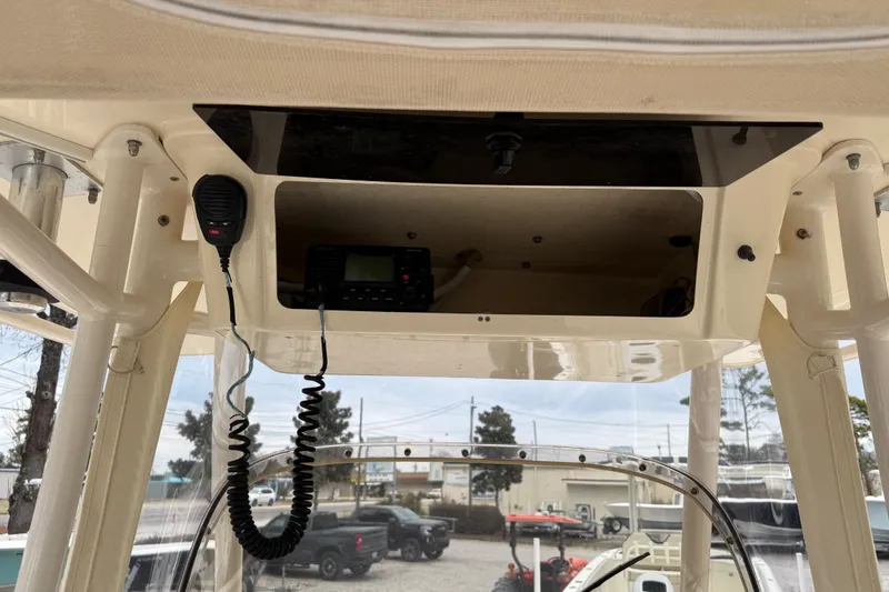 Slide: The Image of 2015 Grady-White Fisherman 257 boat console with radio and microphone. - 26