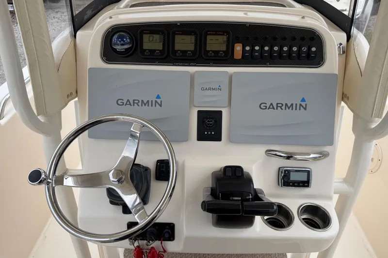 Slide: The Image of 2015 Grady-White Fisherman 257 boat dashboard with Garmin navigation system. - 27